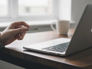 External hard drive plugged into a MacBook Air.
